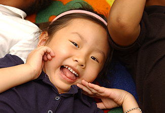 Should My Child Apply Little girl Smiling in Class