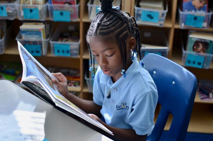 About My School DC Young girl reading a book